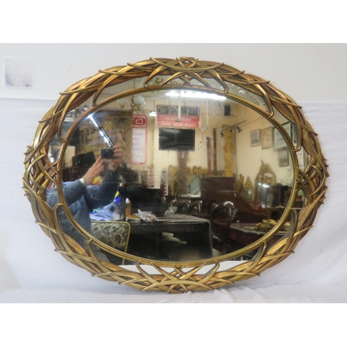 164 - Art Deco style oval double gilt framed wall mirror with scroll decoration