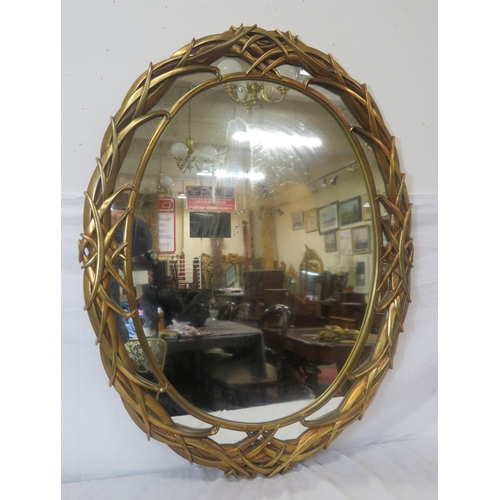 164 - Art Deco style oval double gilt framed wall mirror with scroll decoration