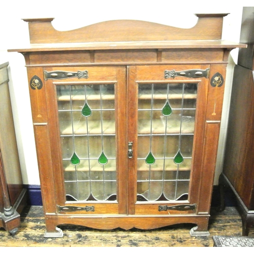 205 - Art Nouveau mahogany display cabinet with leaded glazed doors, shelved interior, shaped hinges, on b... 