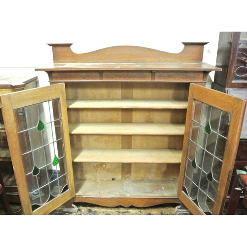 205 - Art Nouveau mahogany display cabinet with leaded glazed doors, shelved interior, shaped hinges, on b... 