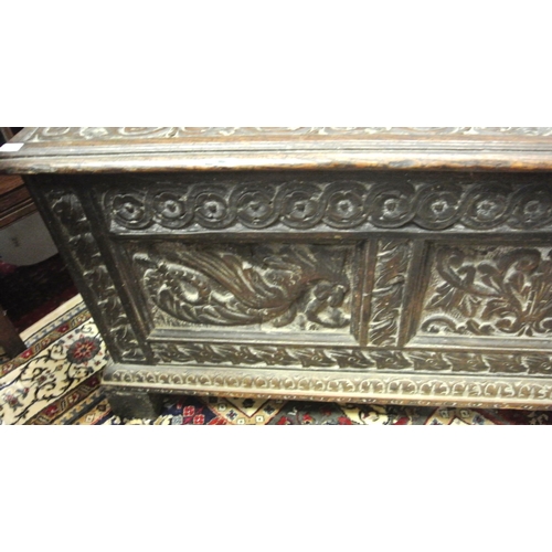 244 - Jacobean style coffer with planked top & carved panels sides