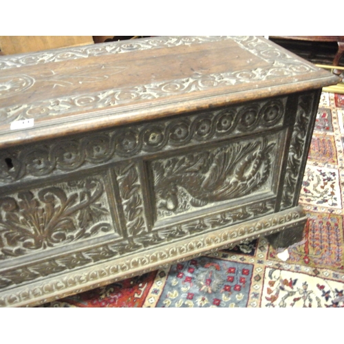 244 - Jacobean style coffer with planked top & carved panels sides