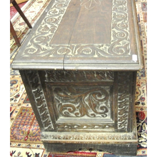 244 - Jacobean style coffer with planked top & carved panels sides