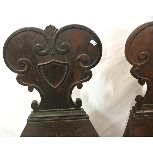 262 - Pair of Victorian mahogany hall chairs with scroll shield shaped decorated backs, bow fronted seats,... 