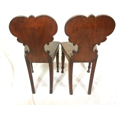 262 - Pair of Victorian mahogany hall chairs with scroll shield shaped decorated backs, bow fronted seats,... 