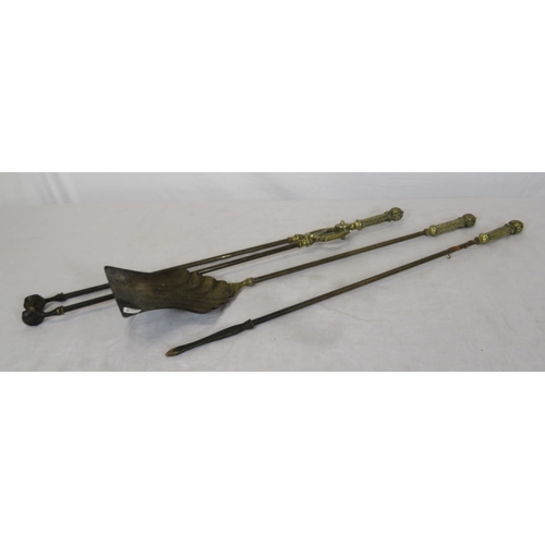 72 - Set of 3 Victorian style brass fire implements with ornate pierced handles and a pair of brass rests