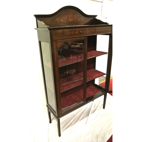 95 - Edwardian inlaid mahogany display cabinet with shaped back, glazed doors, shelved interior, on squar... 