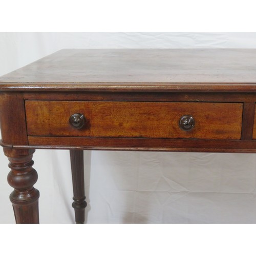 130 - Victorian mahogany side table with frieze drawers, round handles, on turned reeded tapering legs wit... 