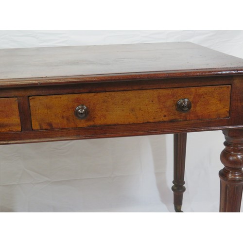 130 - Victorian mahogany side table with frieze drawers, round handles, on turned reeded tapering legs wit... 