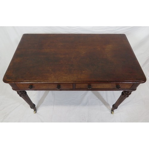 130 - Victorian mahogany side table with frieze drawers, round handles, on turned reeded tapering legs wit... 