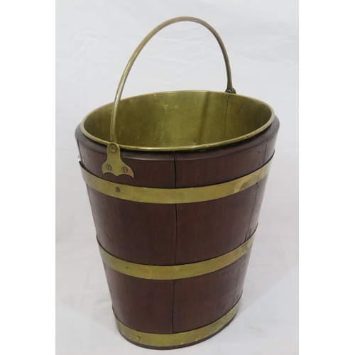 193 - Georgian mahogany oval peat bucket of tapering form with brass banding & handle, & brass bucket inse... 