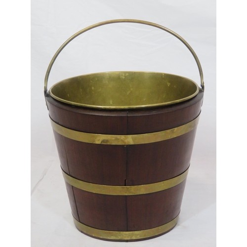 193 - Georgian mahogany oval peat bucket of tapering form with brass banding & handle, & brass bucket inse... 