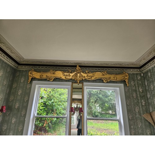 151 - Pair of long parcel gilt and timber pelmets with ornate scroll & foliate decoration & central medall... 