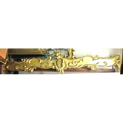 151 - Pair of long parcel gilt and timber pelmets with ornate scroll & foliate decoration & central medall... 