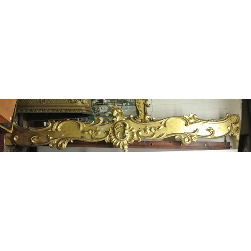 151 - Pair of long parcel gilt and timber pelmets with ornate scroll & foliate decoration & central medall... 