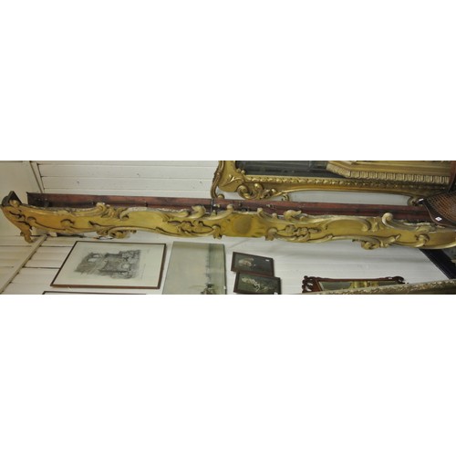 151 - Pair of long parcel gilt and timber pelmets with ornate scroll & foliate decoration & central medall... 