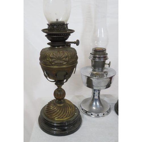 117 - 3 vintage table oil lamps with round bases & shaped glass chimneys