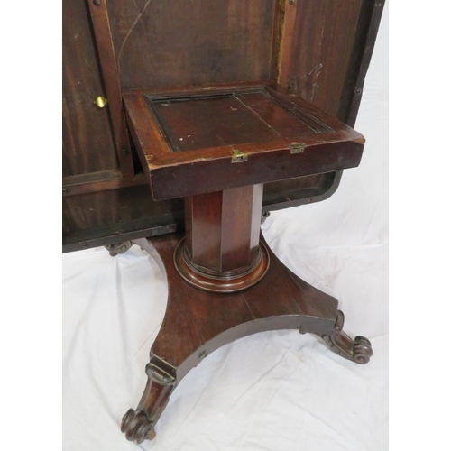 125 - Victorian mahogany dining or library table with tip-up top, hexagonal tapering column with round col... 