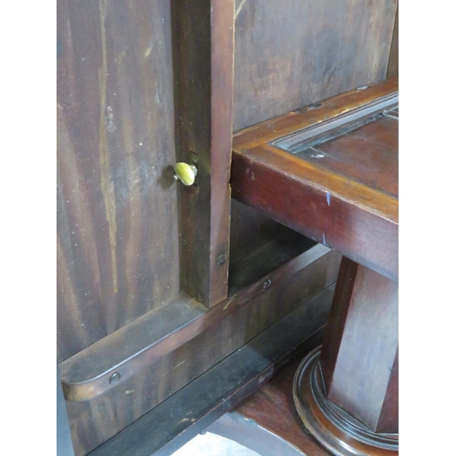 125 - Victorian mahogany dining or library table with tip-up top, hexagonal tapering column with round col... 