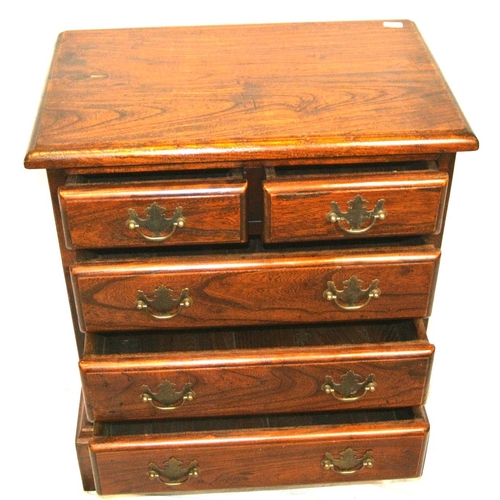 129 - Small oak chest of two short & three long drawers with drop handles, & bracket feet