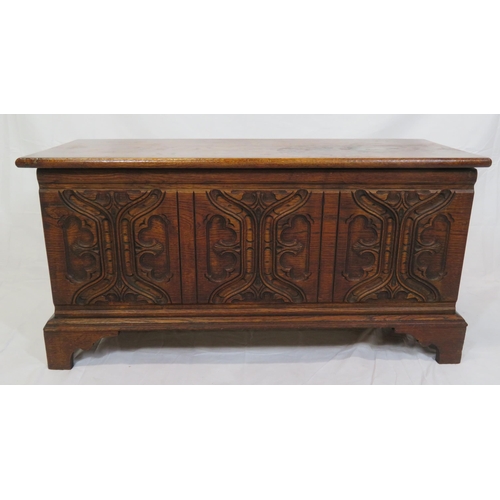 141 - Arts & Crafts style oak coffer with carved panelled sides & bracket feet