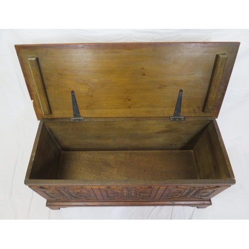 141 - Arts & Crafts style oak coffer with carved panelled sides & bracket feet