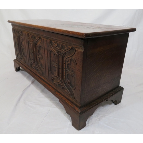 141 - Arts & Crafts style oak coffer with carved panelled sides & bracket feet