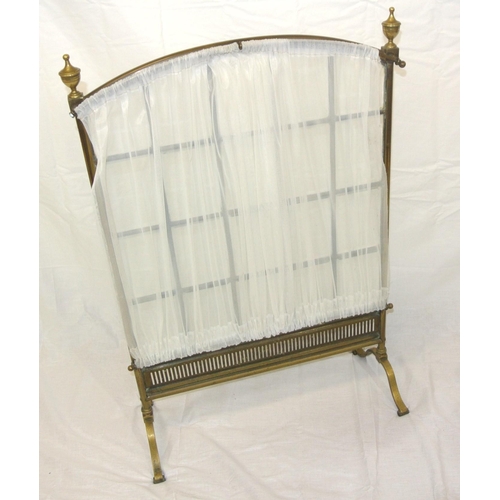 162 - Edwardian brass framed meshed firescreen with bevelled glass insets, on bracket feet