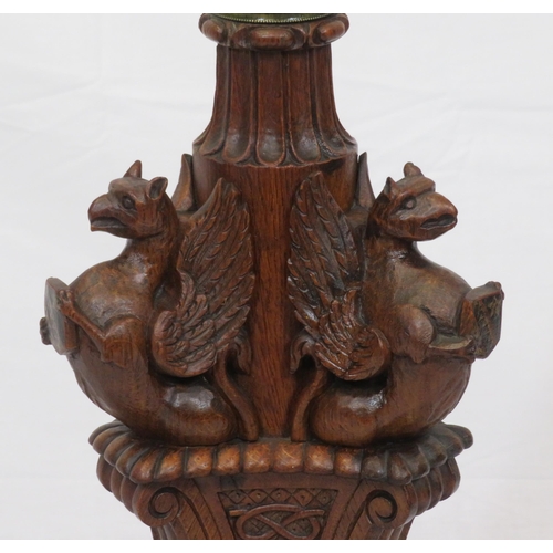 173 - Pugin style brass & timber garment stand with adjustable top, carved gargoyles with shields, on shap... 