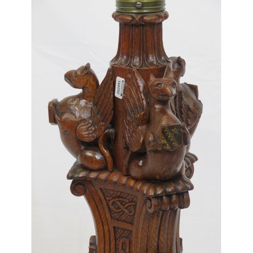 173 - Pugin style brass & timber garment stand with adjustable top, carved gargoyles with shields, on shap... 