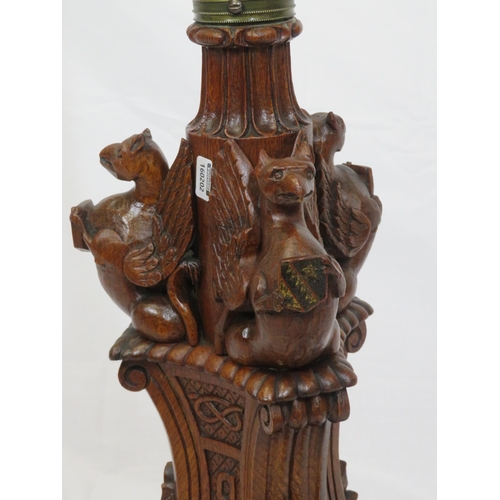 173 - Pugin style brass & timber garment stand with adjustable top, carved gargoyles with shields, on shap... 