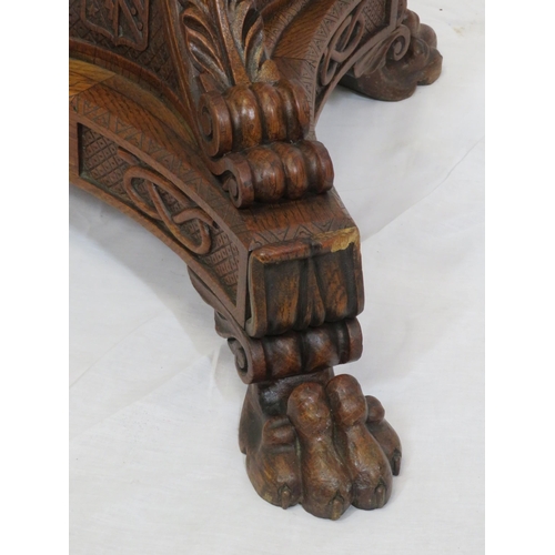 173 - Pugin style brass & timber garment stand with adjustable top, carved gargoyles with shields, on shap... 