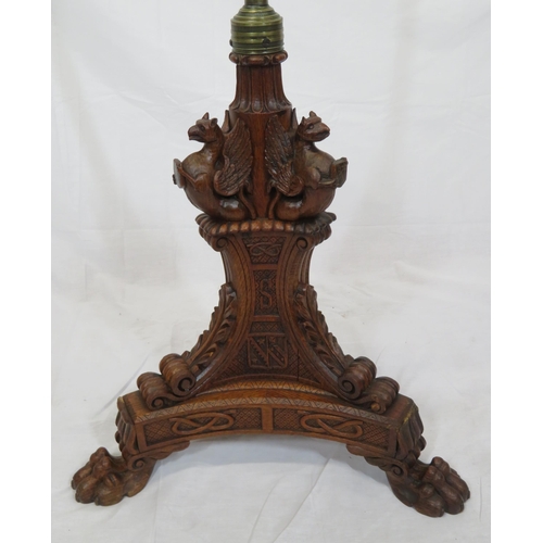 173 - Pugin style brass & timber garment stand with adjustable top, carved gargoyles with shields, on shap... 