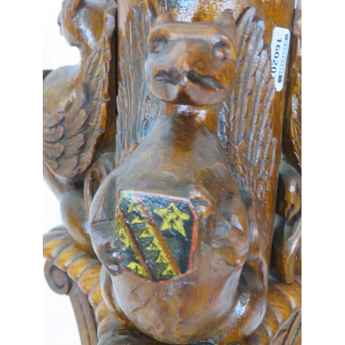 173 - Pugin style brass & timber garment stand with adjustable top, carved gargoyles with shields, on shap... 