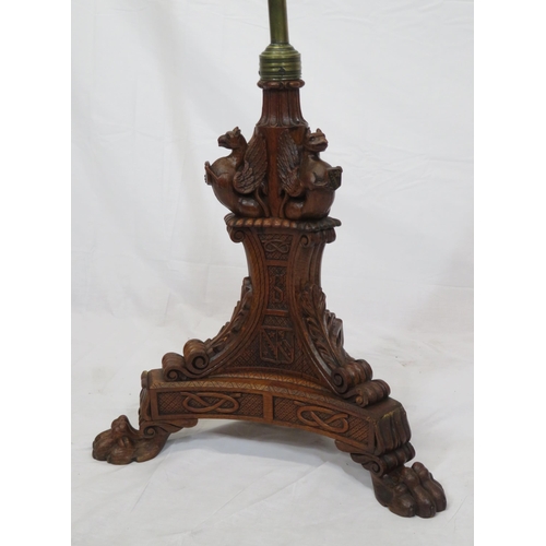 173 - Pugin style brass & timber garment stand with adjustable top, carved gargoyles with shields, on shap... 