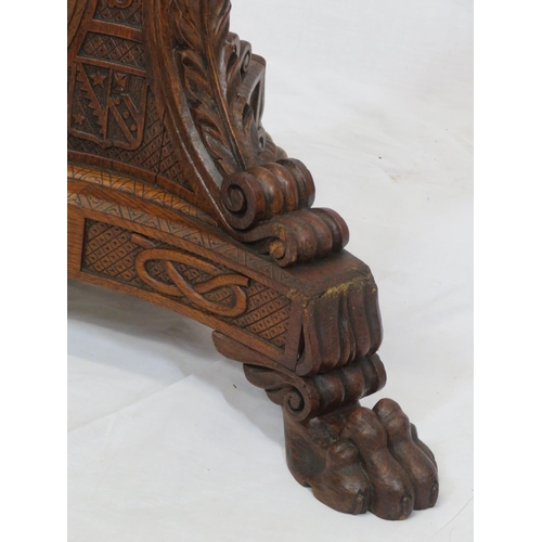 173 - Pugin style brass & timber garment stand with adjustable top, carved gargoyles with shields, on shap... 