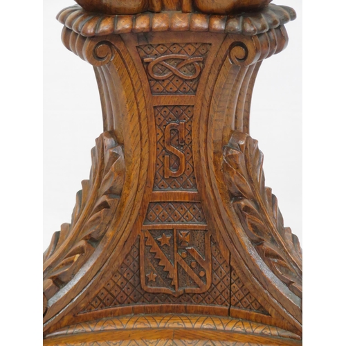 173 - Pugin style brass & timber garment stand with adjustable top, carved gargoyles with shields, on shap... 