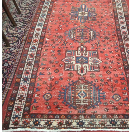 187 - Washed red ground vintage Persian Heriz runner with medallion design 325 x 120cm