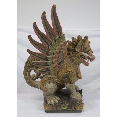 188 - Oriental carved timber temple dragon, ornately carved & with painted decoration, on shaped base