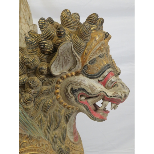 188 - Oriental carved timber temple dragon, ornately carved & with painted decoration, on shaped base