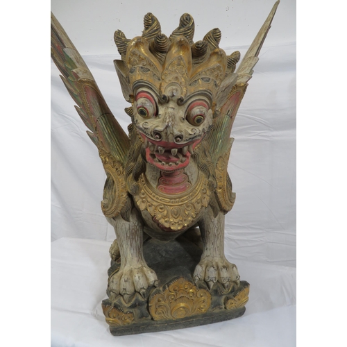 188 - Oriental carved timber temple dragon, ornately carved & with painted decoration, on shaped base