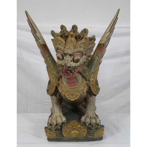 188 - Oriental carved timber temple dragon, ornately carved & with painted decoration, on shaped base