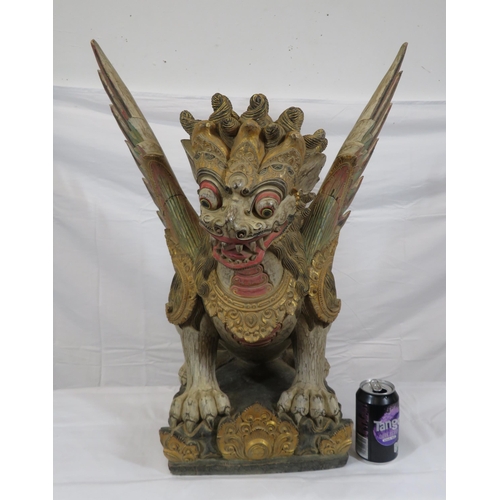 188 - Oriental carved timber temple dragon, ornately carved & with painted decoration, on shaped base