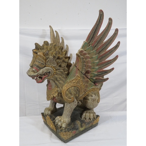 188 - Oriental carved timber temple dragon, ornately carved & with painted decoration, on shaped base