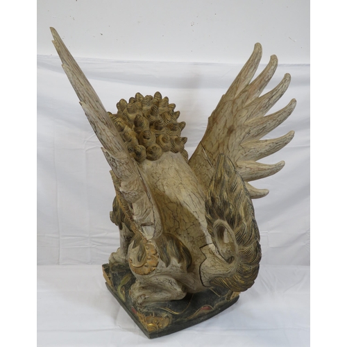 188 - Oriental carved timber temple dragon, ornately carved & with painted decoration, on shaped base