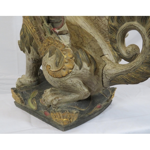 188 - Oriental carved timber temple dragon, ornately carved & with painted decoration, on shaped base