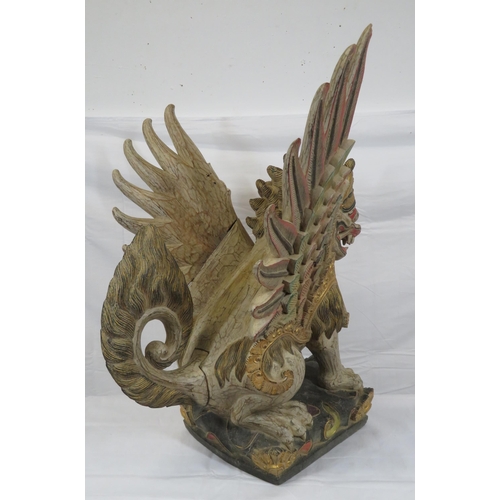 188 - Oriental carved timber temple dragon, ornately carved & with painted decoration, on shaped base