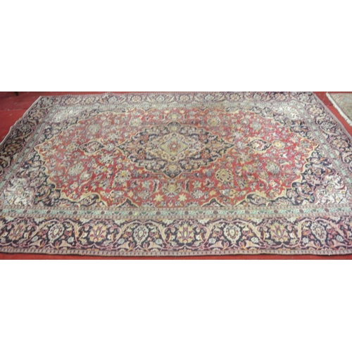 242 - Red ground Persian Kashan carpet with floral medallion design 333x225