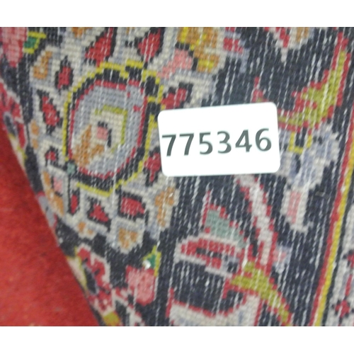 242 - Red ground Persian Kashan carpet with floral medallion design 333x225