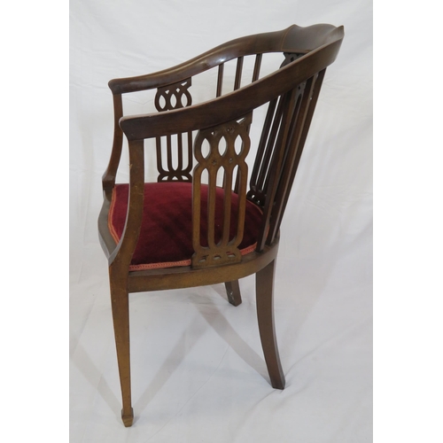 388 - Edwardian inlaid mahogany bowed tub chair with pierced splats, serpentine fronted seat, on tapering ... 